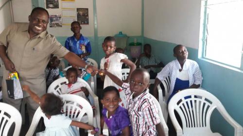 Reverend Barnet Kapten giving gifts to orphans