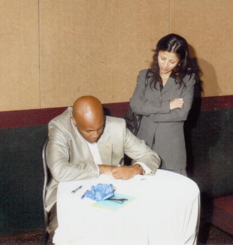 Rodrick Walters signing a copy of his book 