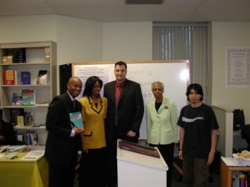 Rodrick with college faculty after presentation